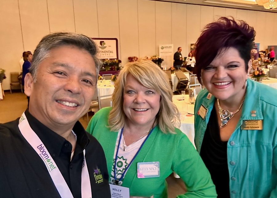 Renato Cruz Sogueco with floral industry colleagues at a trade event